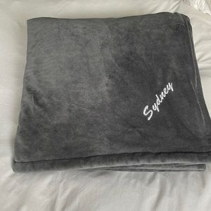 Embroidered plush throw blanket with the name Sydney